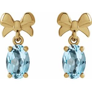 14K Yellow Gold Oval 6 X 4 Mm Natural Sky Blue Topaz Bow Earrings