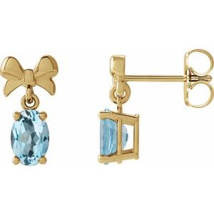 14K Yellow Gold Oval 6 X 4 Mm Natural Sky Blue Topaz Bow Earrings